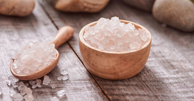 Salt of the Earth - Himalayan Sea Salt in wooden bowl with scoop.